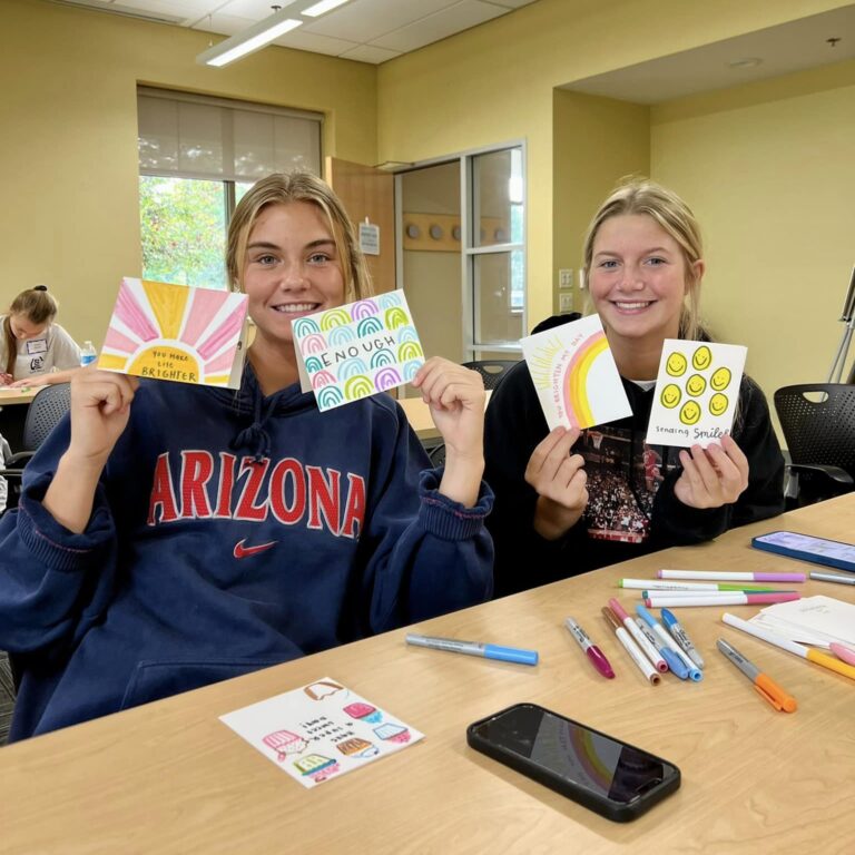 volunteers write encouragement cards